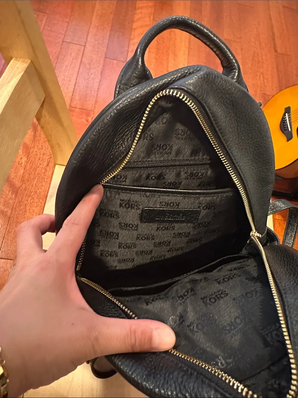 Michael Kors Black Pebbled Leather Mini Backpack with Gold Plaque